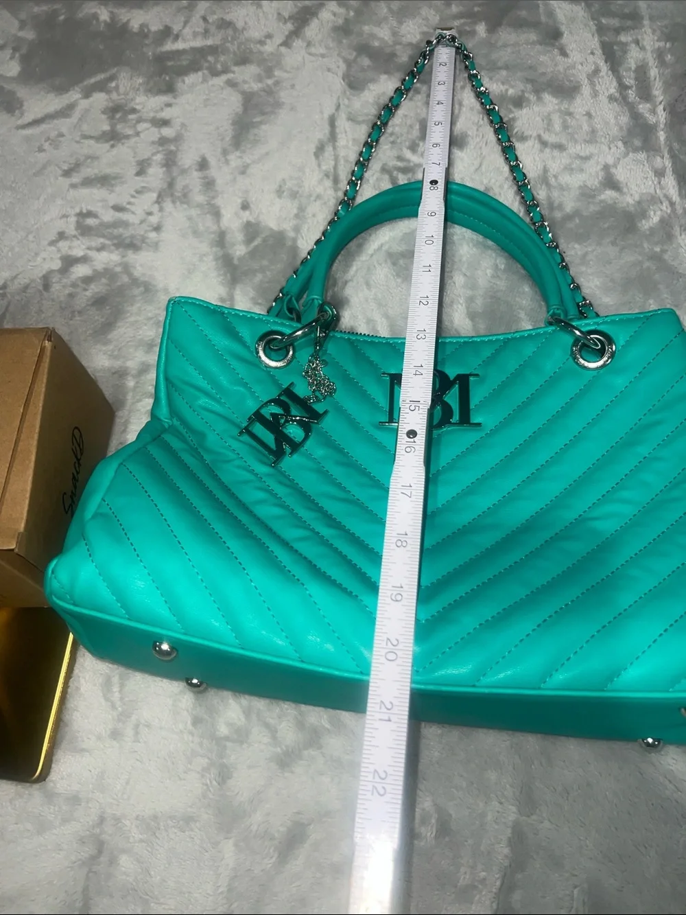 Badgley Mischka Chevron Quilted Shoulder Bag in a vibrant teal/mint green hue.